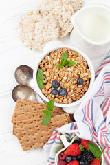 Healthy breakfast set with muesli, berries and milk