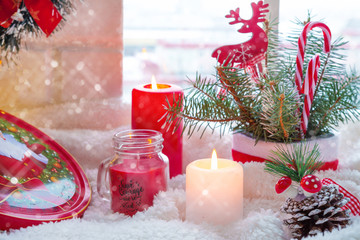 Merry Christmas! Magic gift box on the sill. Window decorated for holidays