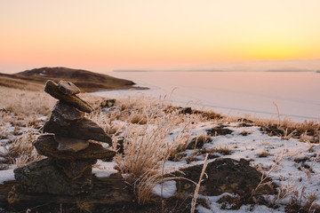 rock in in the rays of the setting sun on the island of Olkhon, lake Baikal