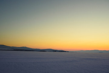 sunset in the vast expanses of Lake Baikal on Olkhon Island