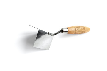 Wooden construction trowel for corners isolated on white background