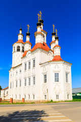 Russian white orthodox Temple of the Entry of the Lord into Jerusalem against the blue sky The Nativity Church, Totma, Russia. Architectural forms reminiscent of a ship.