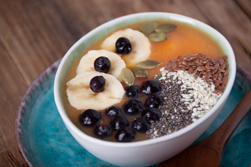 Pumpkin smoothies with banana and blueberries and  seeds