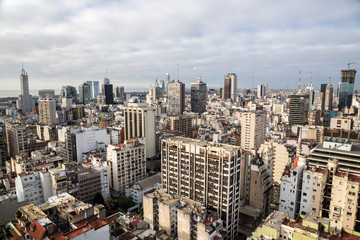 Buenos Aires Central Business District (Microcentro) skyscrapers skyline in winter under cloudy lead sky. Argentina, South, Latin America aerial view.