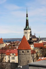Obraz premium View of the towers and roofs of Old Tallinn from the fortress wall.