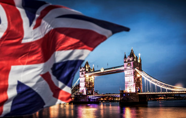 Fototapeta na wymiar brexit concept - double exposure of Tower bridge and flags