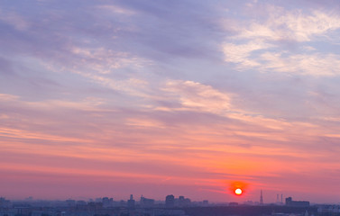 sunrise sky over the city at cold summer morning. background, nature.