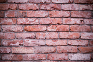 old weathered red brick wall texture, background. vignette, exterior