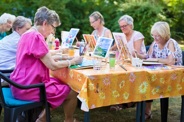 Senior women taking art lessons.