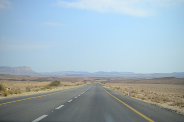 High road at bottom of Makhtesh Ramon Crater, Mitzpe Ramon, Negev desert, Israel