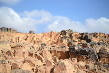 Fototapeta na wymiar Natural rocks at bottom of Makhtesh Ramon Crater, Mitzpe Ramon, Negev desert, Israel