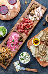 Antipasto Platter. Ham serrano, salami olive jamon dip sauces and red wine