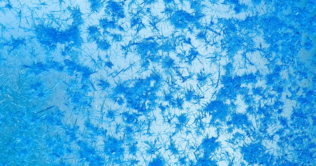 Frozen ice window texture, snowflakes and icy background, close-up, soft focus