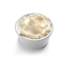 Bowl of tasty cream cheese on white background