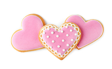 Decorated heart shaped cookies on white background, top view