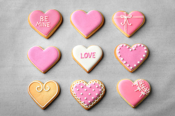 Decorated heart shaped cookies on color background, top view. Valentine's day treat
