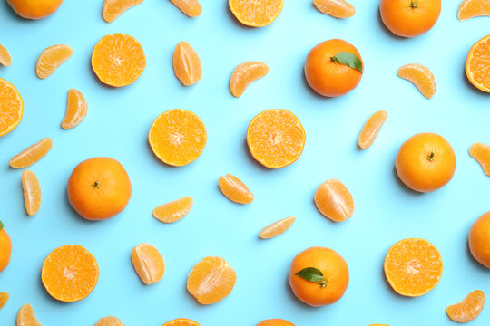 Composition with tangerines on color background, flat lay