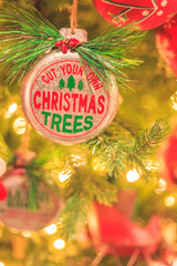 Christmas Ornament with Text Saying Cut Your Own Christmas Tree