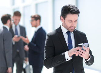 businessman looking at the smartphone screen