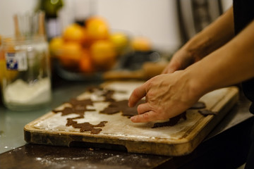 Making Gingerbread Cookies Series. Cutting dough sheet into shapes.