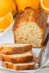 Homemade orange fruit loaf cake with citrus candied fruits and nuts.  Traditional treat for tea for Breakfast. Pound cake. Selective focus