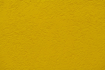 Fototapeta premium The texture of plastered gold or goldenrod wall, background