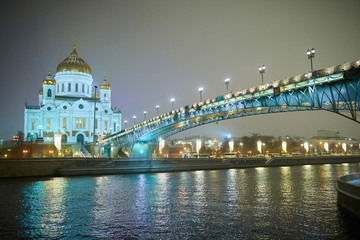 Night winter view to the Cathedral of Christ the Saviour with bridge and river