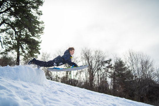 Little Dare Devil Jumping Ramp Snow Sledding 