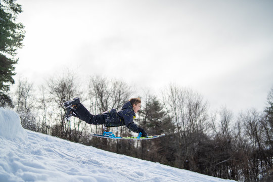 Little Dare Devil Jumping Ramp Snow Sledding 