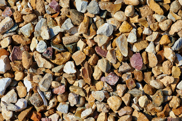 The texture of colorful gravel or macadam, background, close-up