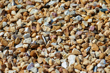 The texture of colorful gravel or macadam, background