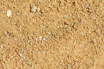 The texture of yellow coarse sand in a career