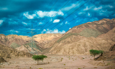 Power lines passing through the mountains of Egypt
