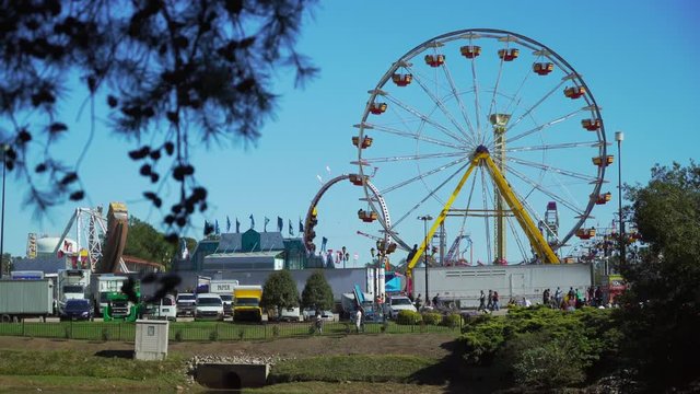 Wide shot of ferris wheel at outdoor festival fair