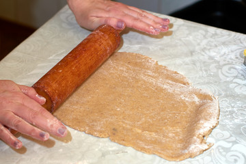 rolled out dough on the table for baking cookies