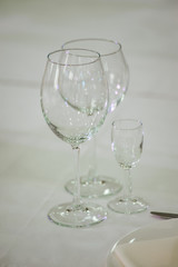 Empty glass on a white wedding table.