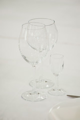Empty glass on a white wedding table.