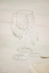 Empty glass on a white wedding table.
