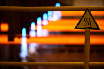 Iron factory with hot candent block of iron or steel or zinc in process of production or cooling