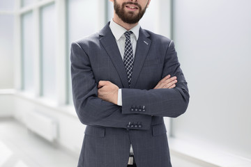 close up.handsome businessman standing in the office