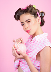 pin up woman with trendy makeup. pinup girl with fashion hair. retro woman with moneybox. loan. Money. Housewife. pretty girl in vintage style. I love money and they love me
