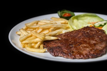 hamburger with french fries isolated on plate.