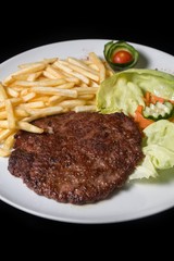 hamburger with french fries isolated on plate.