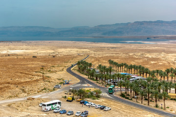 View from the cable car on Mount Massada Israel, on the ground floor with palm trees sheltered