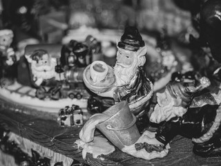 Christmas decorations, tiny figurines, toys, tiny village, black and white.