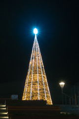 Naklejka premium Huge light Christmas Tree in city center of gdansk at night.