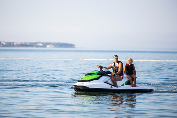Two person's on water scooter