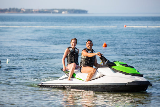 Having fun riding the water scooter