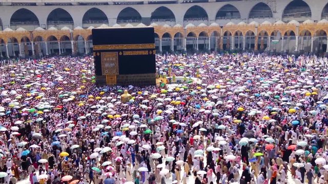 Circumambulation with umbrellas  (Tawaf) around 'Holy Kaaba', in Mecca, Saudi Arabia