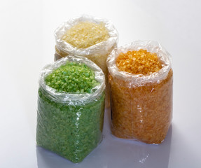 closeup of Multicolored sea salt in plastic bags on the market.